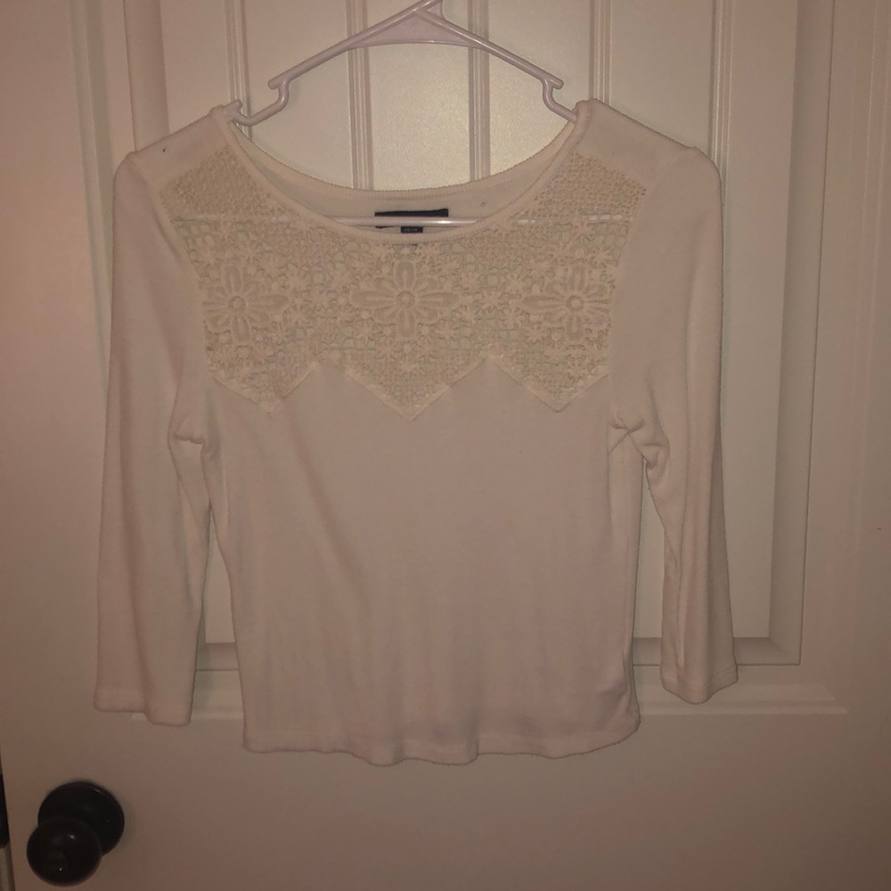 White shirt with 3/4 sleeve and lacing on top